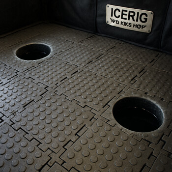 Test tiles showing different floor grip patterns under a boot print