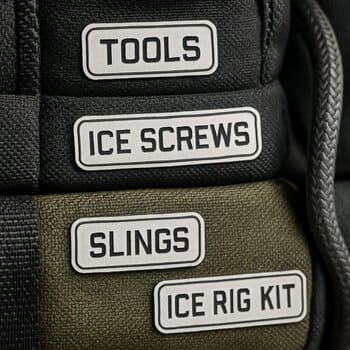 Close-up of handwritten labels on small parts bags for a rig kit