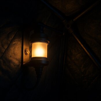 Lantern and soft LED glow inside an organized night shelter